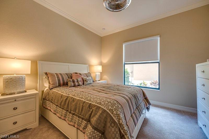6564 Roma Way Naples, FL 34113 - Photo 15 of 22 a bedroom with a bed and a window