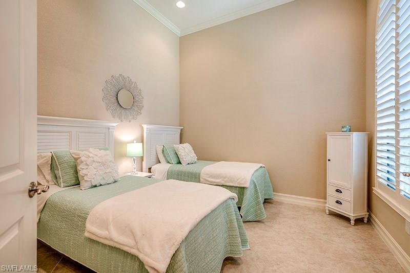 6564 Roma Way Naples, FL 34113 - Photo 16 of 22 a bedroom with bed and window