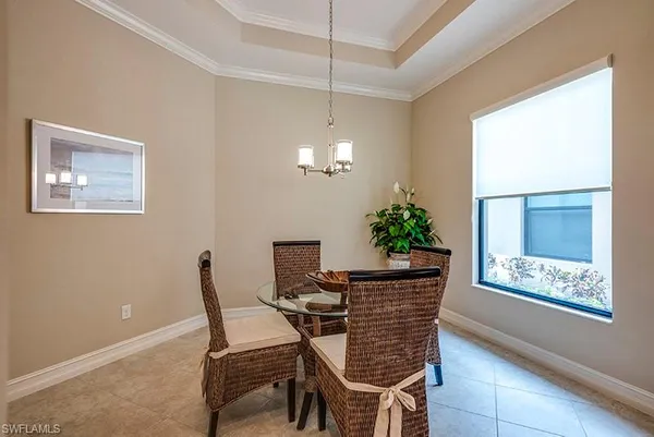 a dining room with furniture and window
