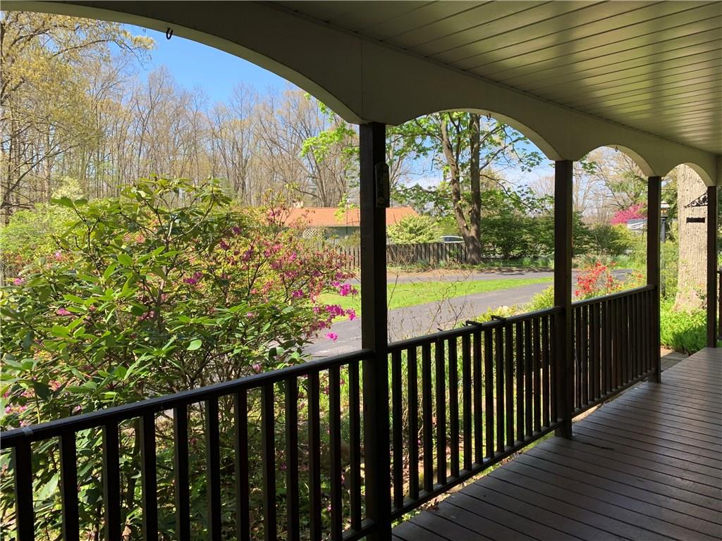470 Myoma Road Mars, PA 16046 - Photo 8 of 25 26x7 Covered front porch surrounded by beautiful greenery! Great place to relax.