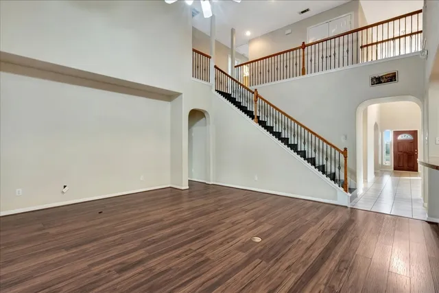 a view of an entryway with wooden floor