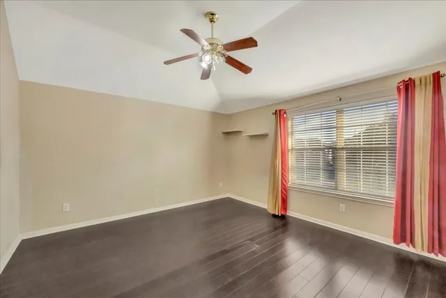 a view of livingroom with hardwood floor and ceiling fan