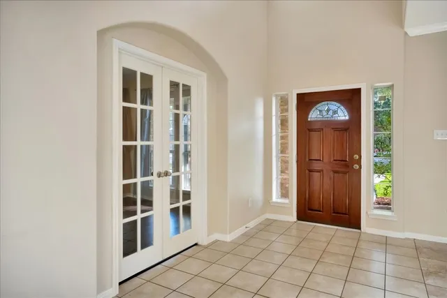 a view of an entryway with wooden floor