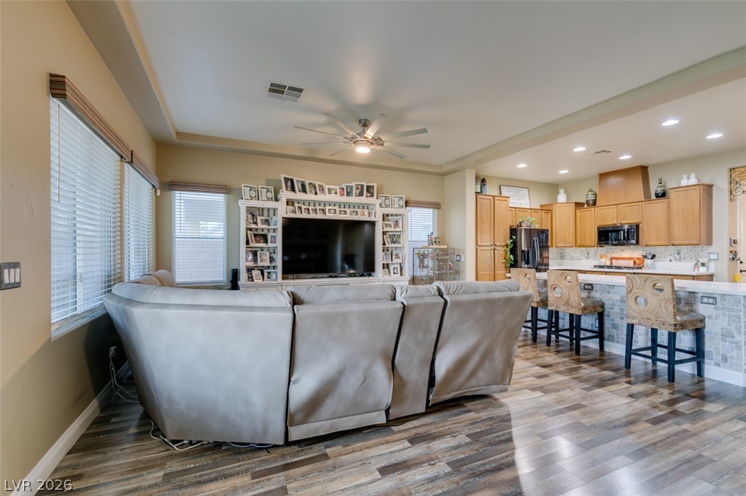 7524 Midnight Rambler Street Las Vegas, NV 89149 - Photo 50 of 51 An open floorplan seamlessly connects the living area with a well-appointed kitchen.