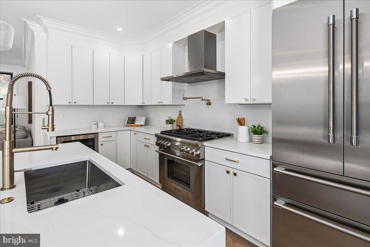 21 Channing Street Northeast Washington, DC 20002 - Photo 13 of 48 a kitchen with stainless steel appliances granite countertop a refrigerator sink and stove