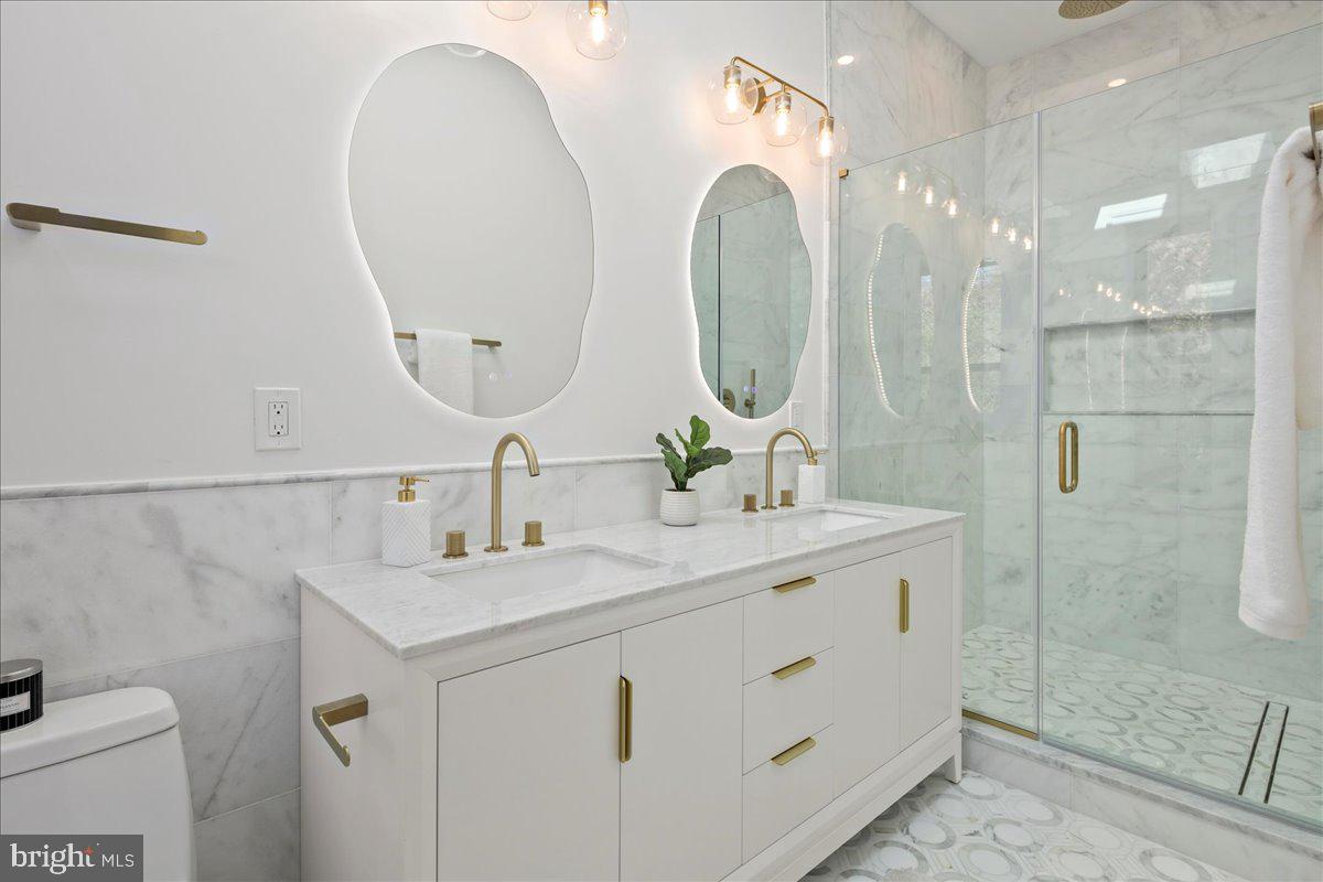 21 Channing Street Northeast Washington, DC 20002 - Photo 20 of 48 a bathroom with a double vanity sink mirror and shower