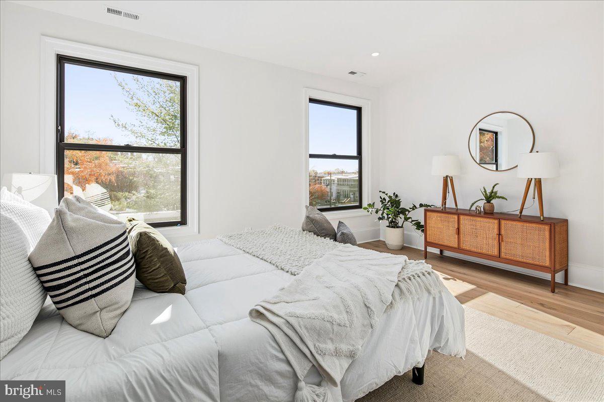 21 Channing Street Northeast Washington, DC 20002 - Photo 22 of 48 a bedroom with a bed and a large window