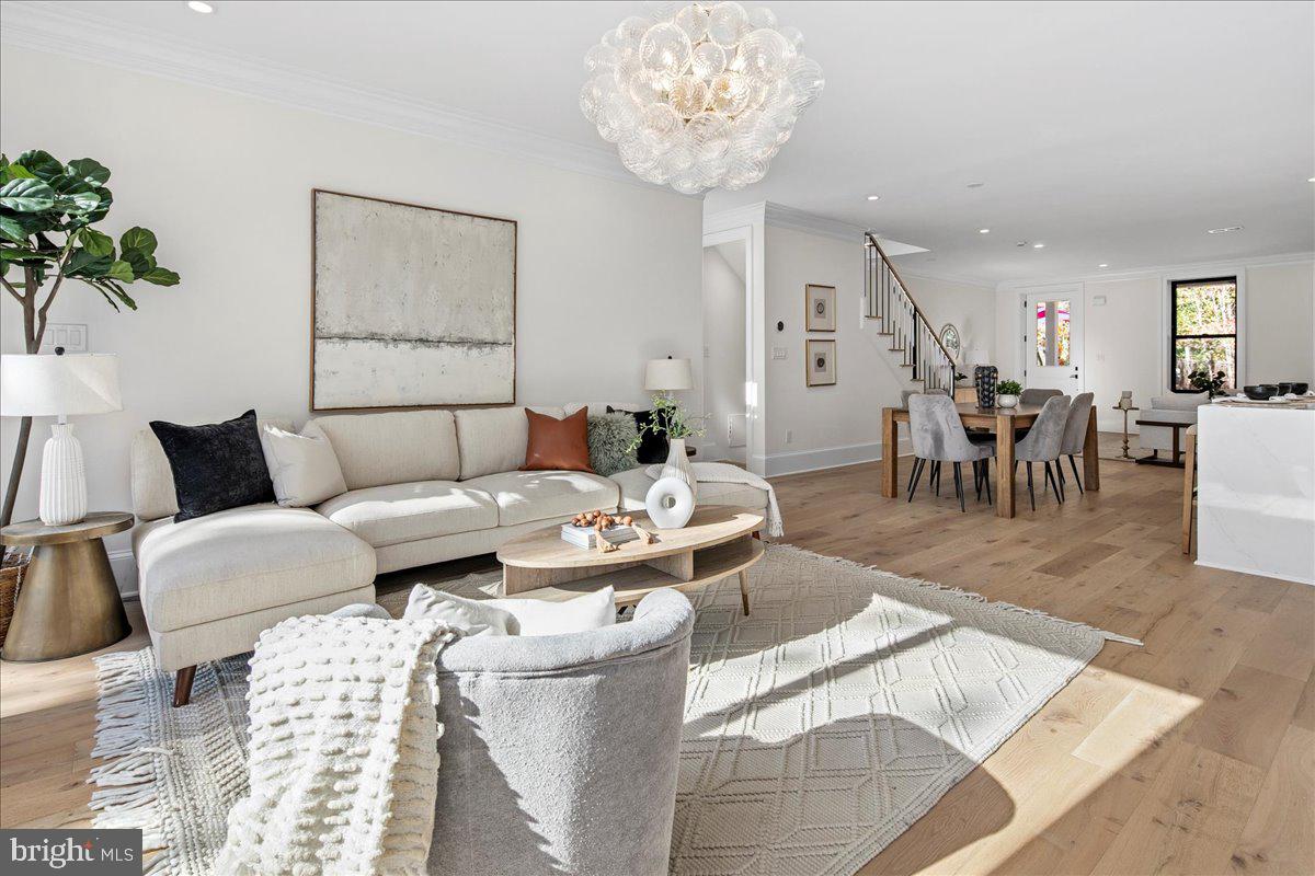 21 Channing Street Northeast Washington, DC 20002 - Photo 8 of 48 a living room with furniture and a chandelier