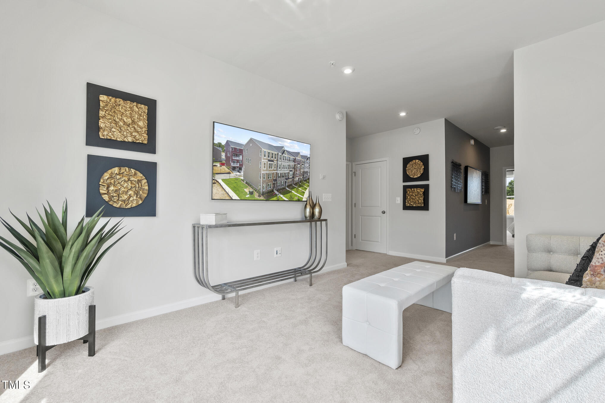 1206 Coach Station Alley, Unit 101 Raleigh, NC 27601 - Photo 18 of 48 a living room with furniture and potted plant