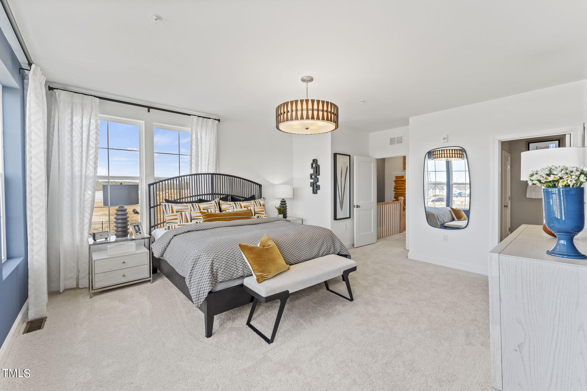 1206 Coach Station Alley, Unit 101 Raleigh, NC 27601 - Photo 25 of 48 a bedroom with a bed and dresser