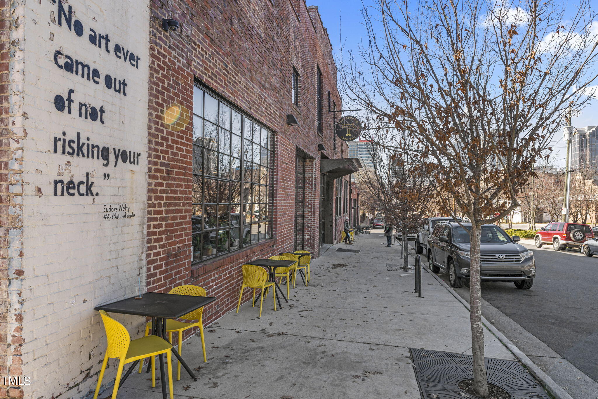 1206 Coach Station Alley, Unit 101 Raleigh, NC 27601 - Photo 43 of 48 a view of a building with sitting area