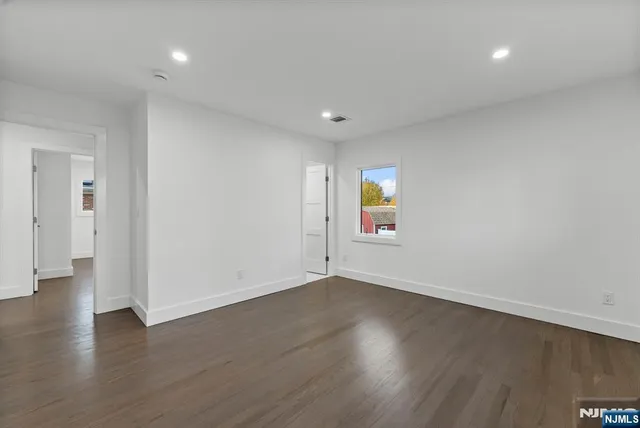 a kitchen with stainless steel appliances a refrigerator and a stove top oven