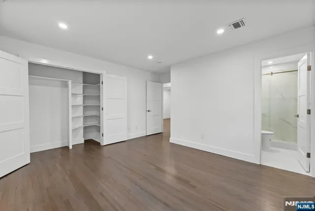 a kitchen with stainless steel appliances a refrigerator sink and cabinets
