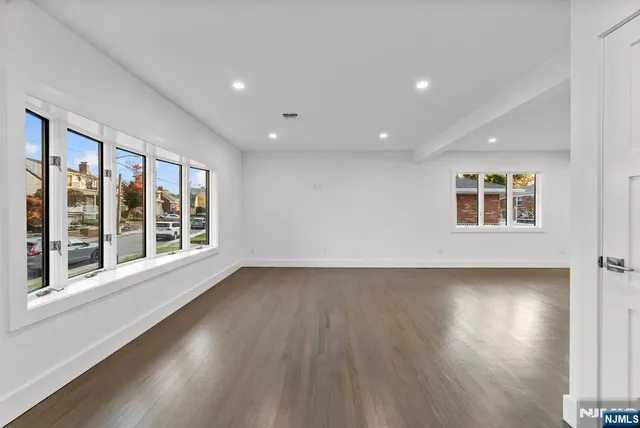 a kitchen with stainless steel appliances granite countertop a stove and a refrigerator