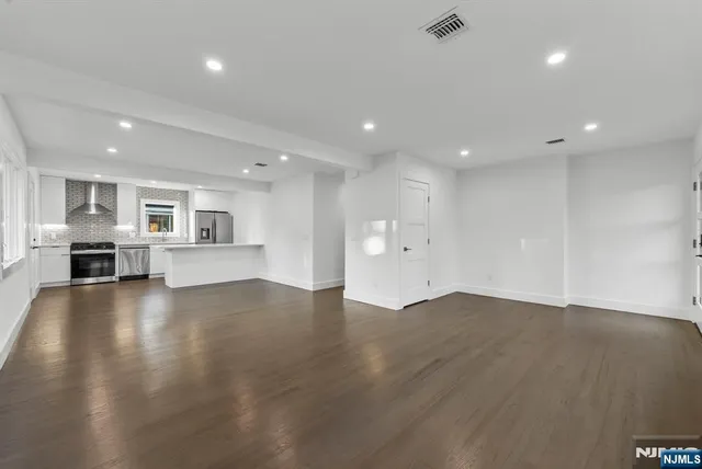 a view of a hallway with washer and dryer