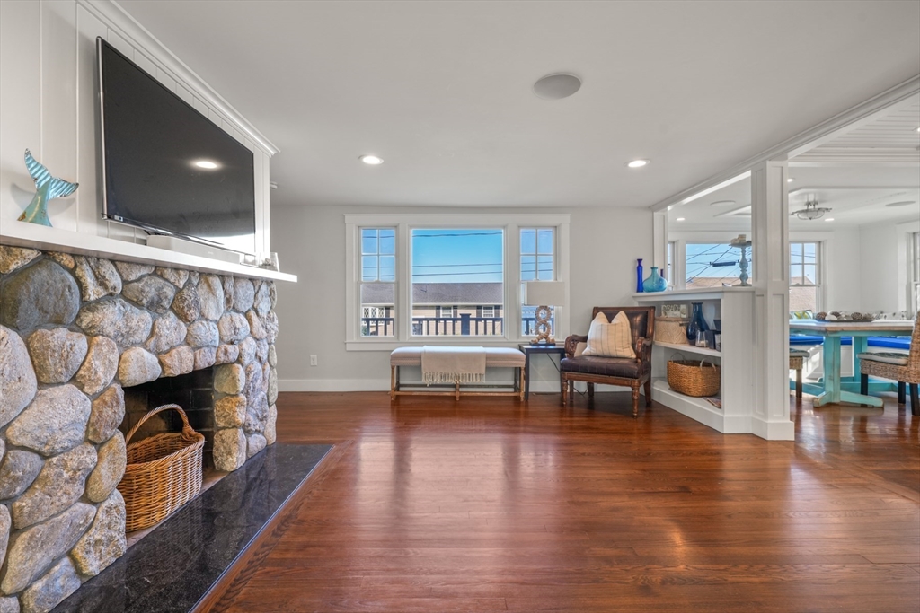 29 Bay Shore Road Hyannis, MA 02601 - Photo 16 of 42 a living room with furniture and a fireplace