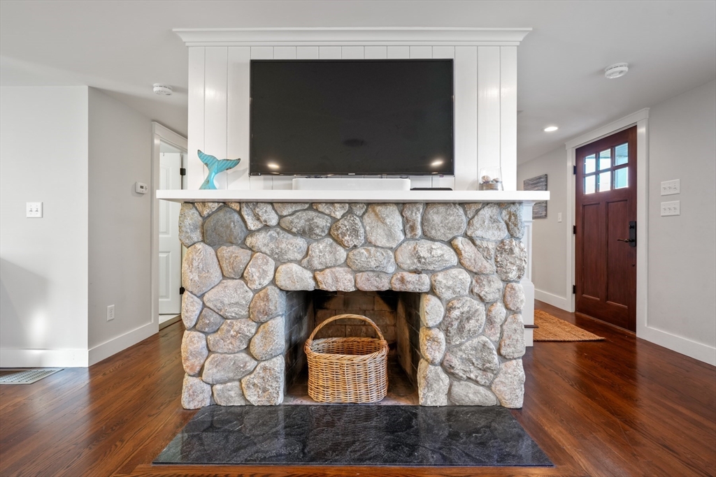 29 Bay Shore Road Hyannis, MA 02601 - Photo 17 of 42 a fireplace with wooden floor