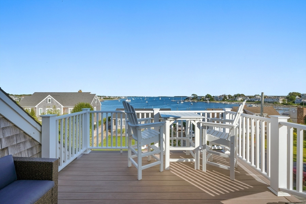 29 Bay Shore Road Hyannis, MA 02601 - Photo 2 of 42 a view of a balcony with two chairs and a table
