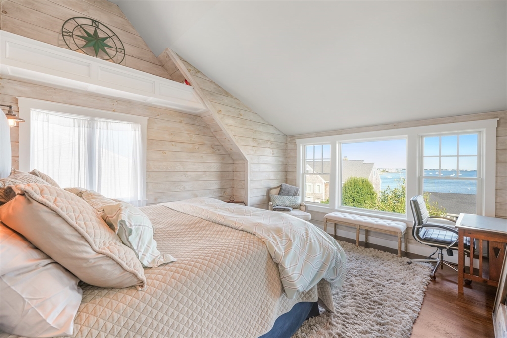 29 Bay Shore Road Hyannis, MA 02601 - Photo 22 of 42 a bed sitting in a bedroom next to a window