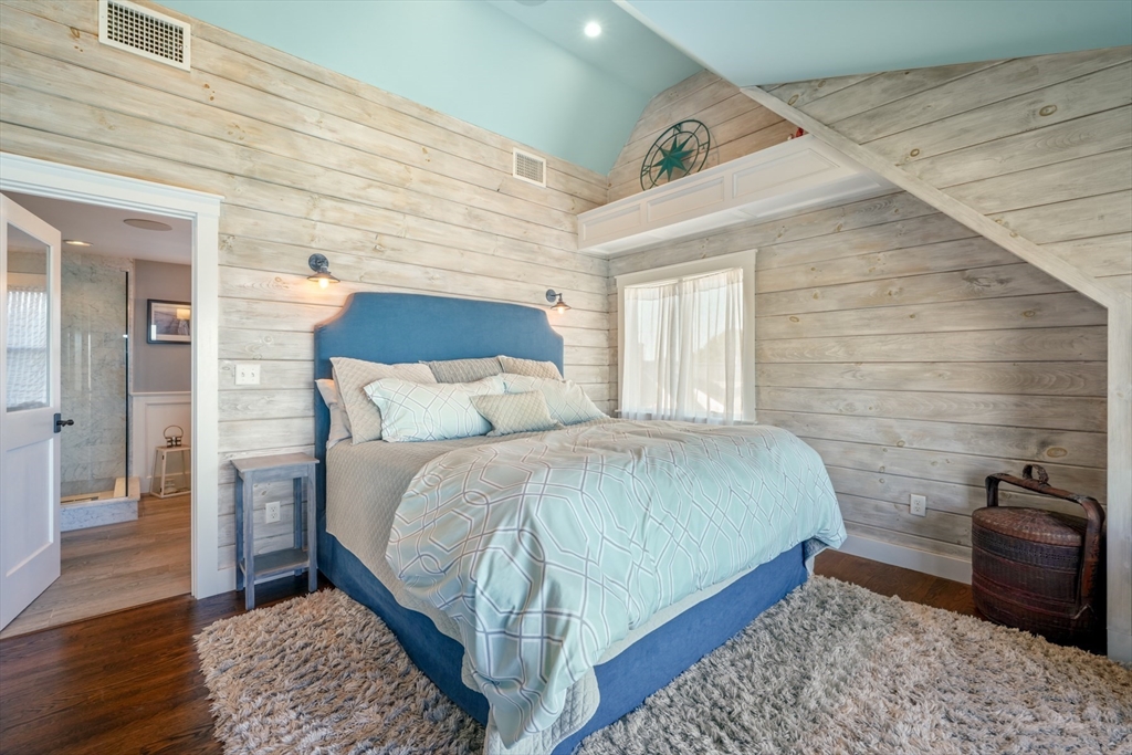 29 Bay Shore Road Hyannis, MA 02601 - Photo 24 of 42 a bedroom with a bed and wooden floor