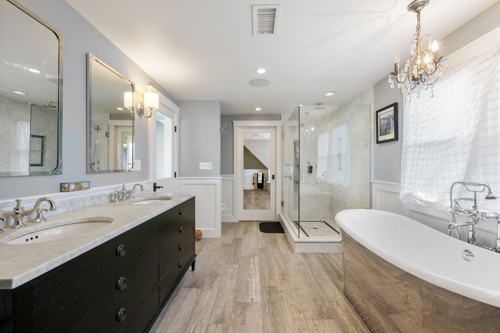 29 Bay Shore Road Hyannis, MA 02601 - Photo 26 of 42 a spacious bathroom with a tub sink shower and mirror