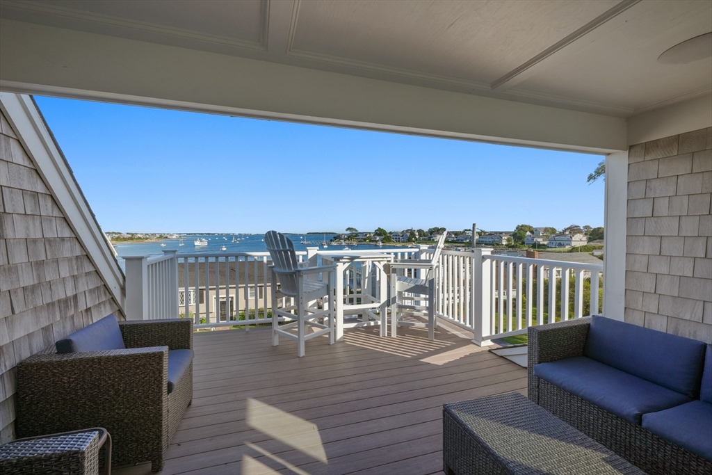 29 Bay Shore Road Hyannis, MA 02601 - Photo 29 of 42 a view of a balcony with a chairs