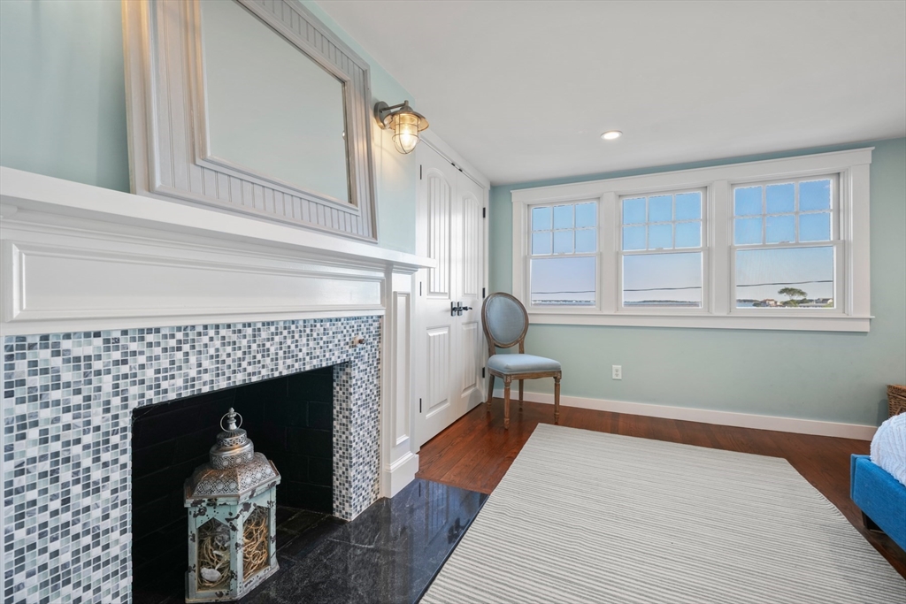 29 Bay Shore Road Hyannis, MA 02601 - Photo 32 of 42 a living room with furniture and a fireplace