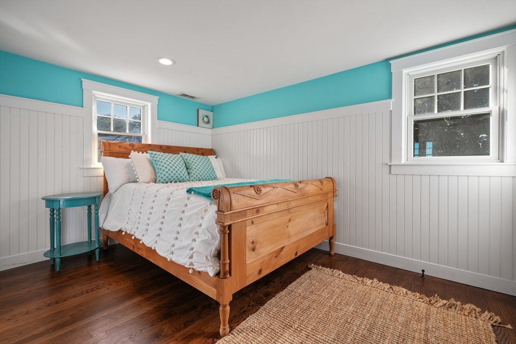 29 Bay Shore Road Hyannis, MA 02601 - Photo 34 of 42 a bed sitting in a bedroom next to a window