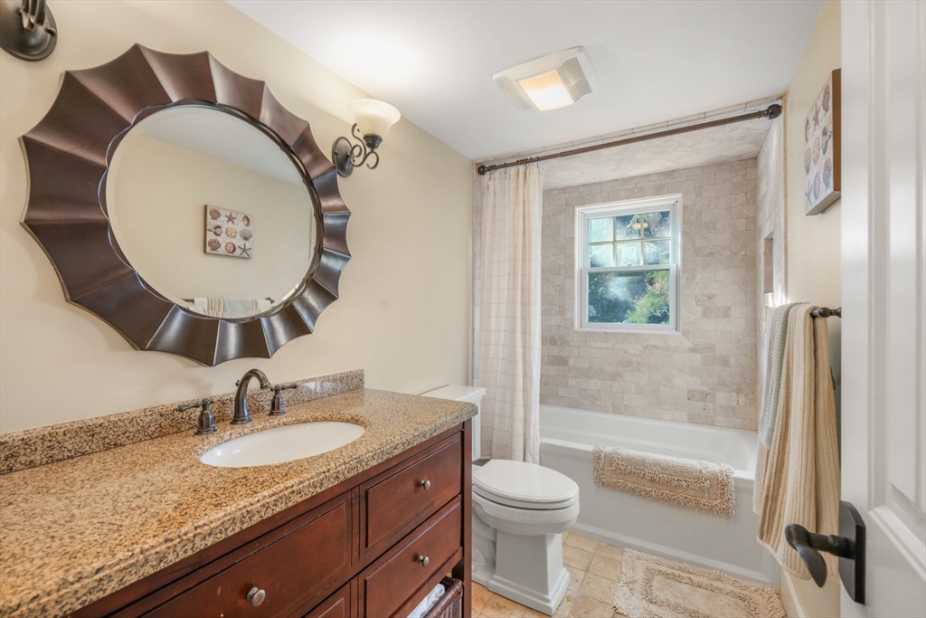 29 Bay Shore Road Hyannis, MA 02601 - Photo 36 of 42 a bathroom with a granite countertop sink mirror vanity and toilet