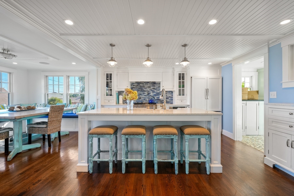 29 Bay Shore Road Hyannis, MA 02601 - Photo 8 of 42 a large kitchen with a table and chairs