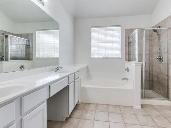 a bath room with a bath tub and a sink