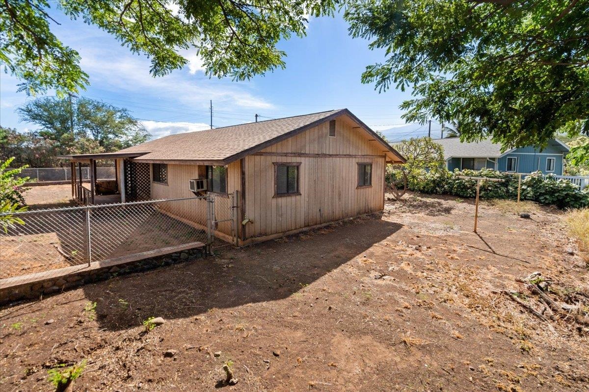2040 Kanakanui Road Kihei, HI 96753 - Photo 18 of 22 a view of a small house with a yard