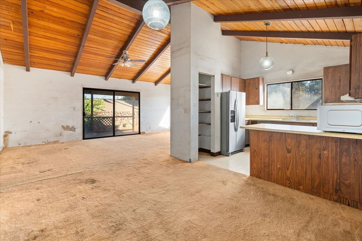 2040 Kanakanui Road Kihei, HI 96753 - Photo 3 of 22 a view of a kitchen with a sink and a refrigerator