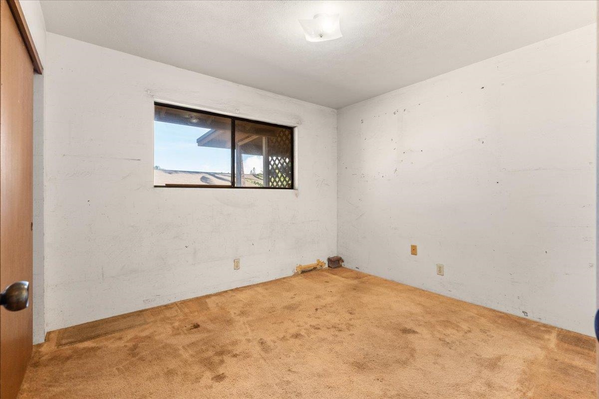 2040 Kanakanui Road Kihei, HI 96753 - Photo 8 of 22 an empty room with a window