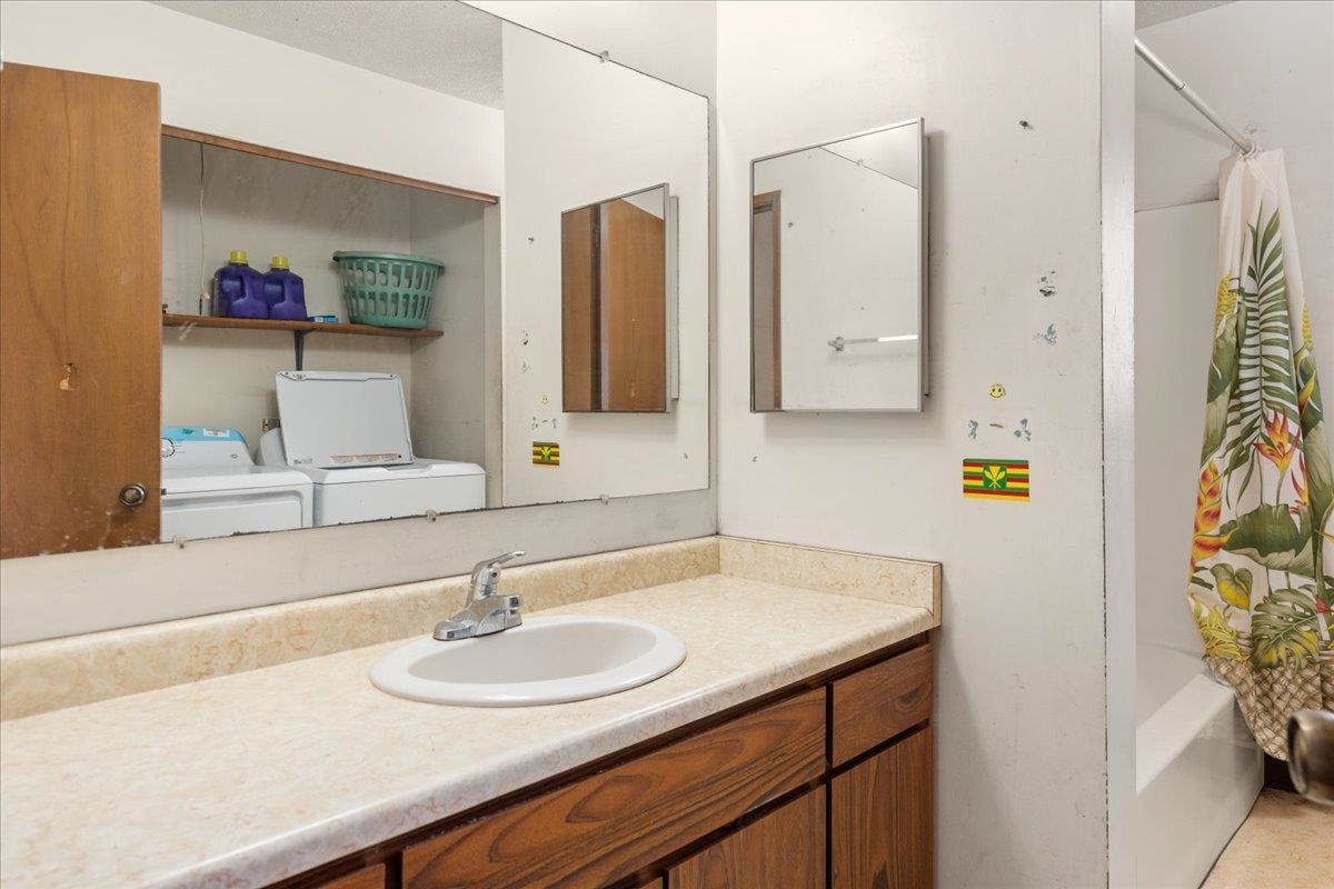 2040 Kanakanui Road Kihei, HI 96753 - Photo 10 of 22 a bathroom with a sink and a mirror