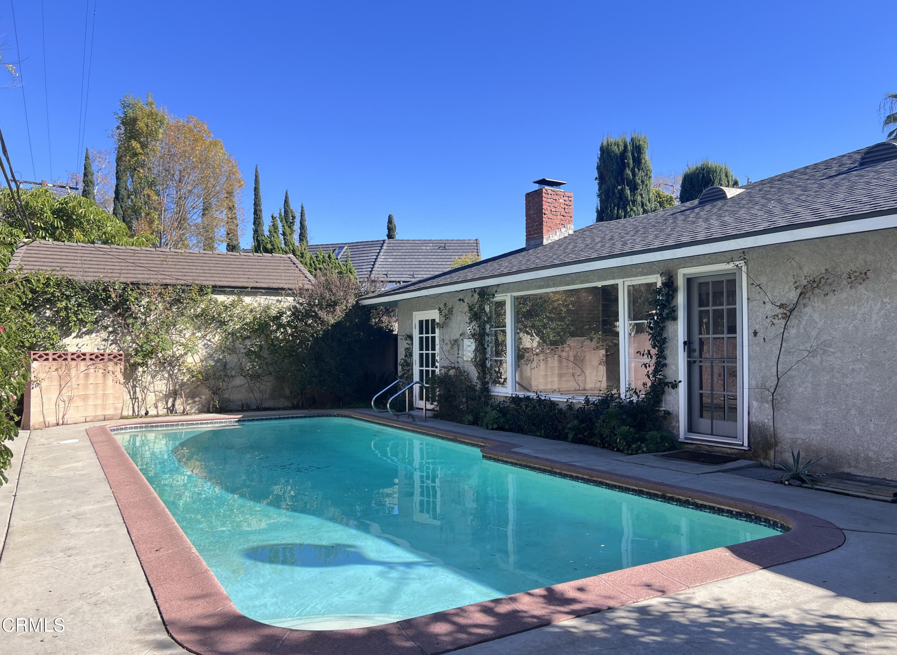 3159 Piccolo Street Pasadena, CA 91107 - Photo 14 of 14 a view of a house with a swimming pool