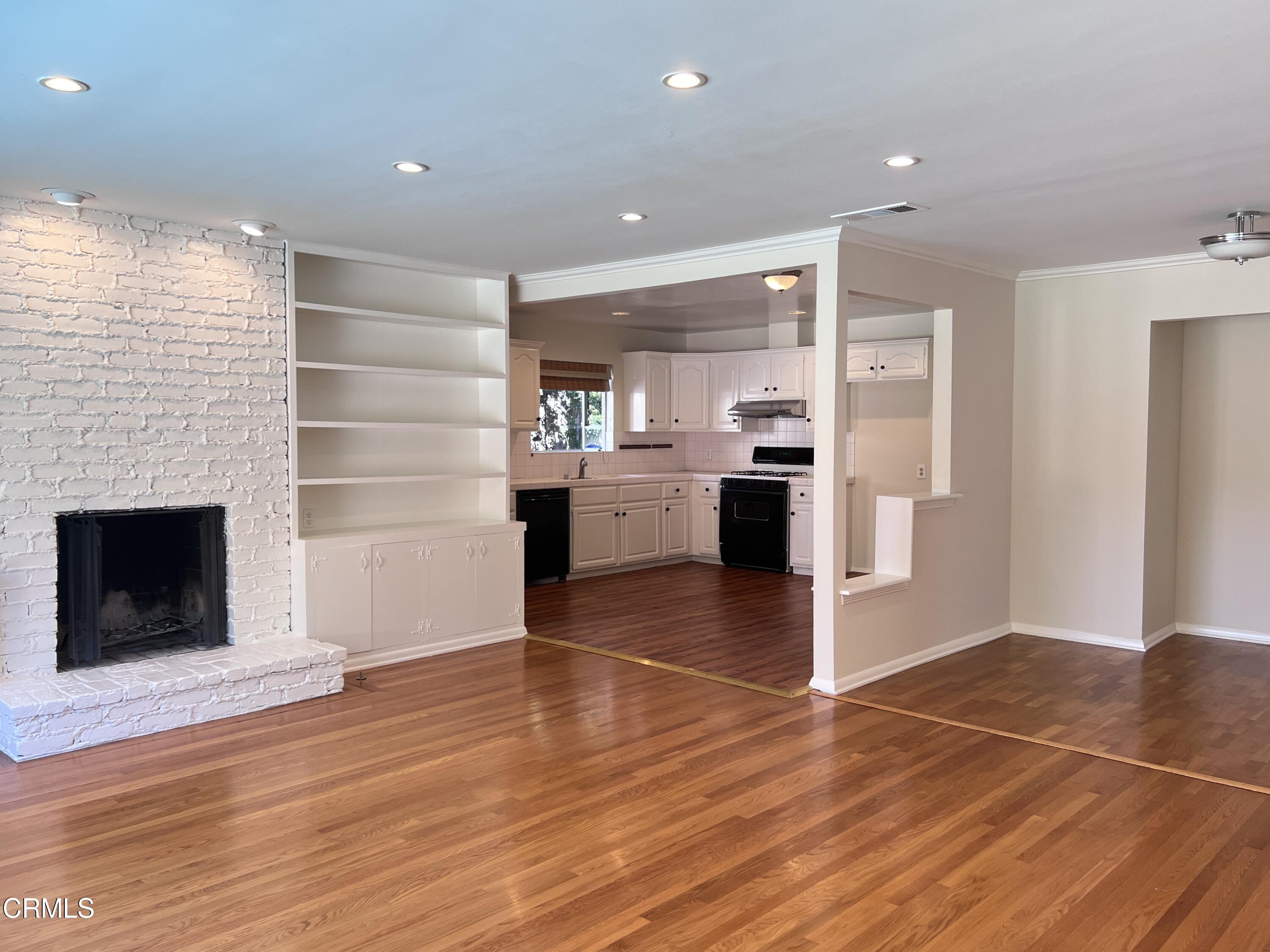 3159 Piccolo Street Pasadena, CA 91107 - Photo 3 of 14 a view of kitchen with stainless steel appliances kitchen island wooden floor and living room