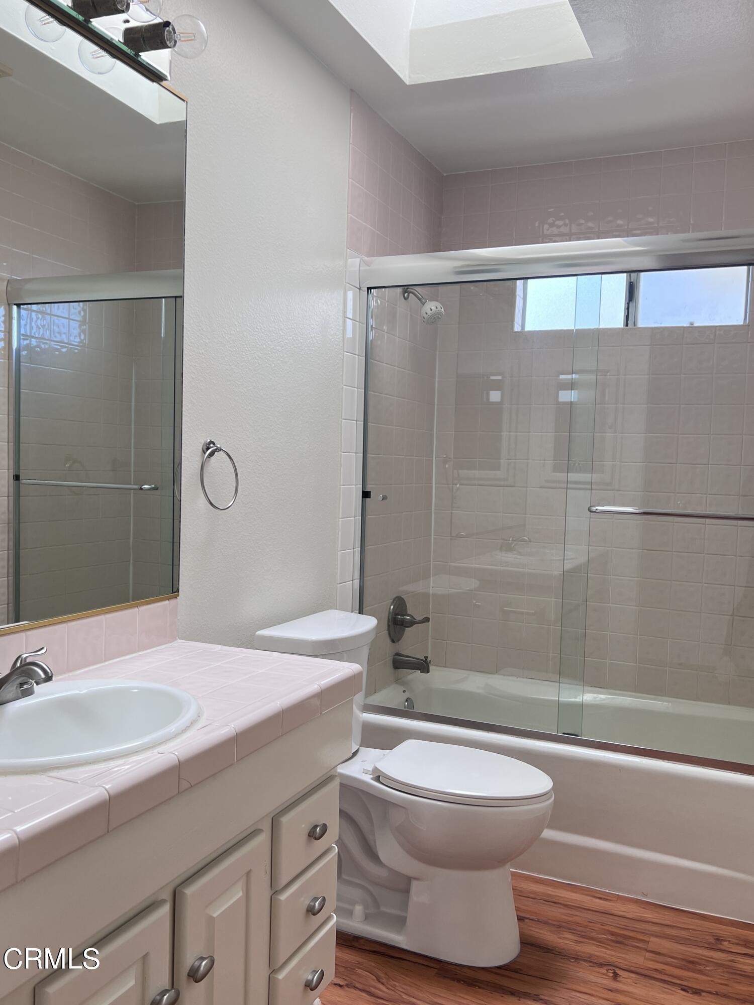 3159 Piccolo Street Pasadena, CA 91107 - Photo 6 of 14 a bathroom with a sink a toilet and shower