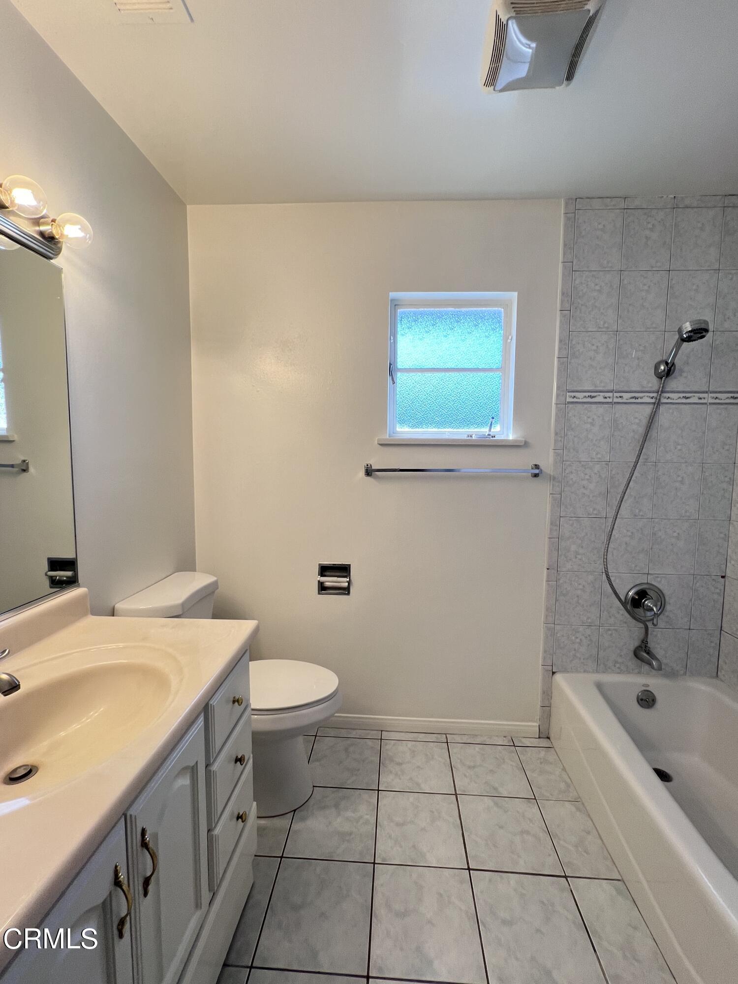 3159 Piccolo Street Pasadena, CA 91107 - Photo 8 of 14 a bathroom with a sink a toilet and shower