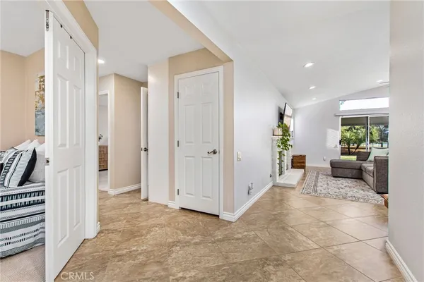 a view of a livingroom with furniture and an entryway