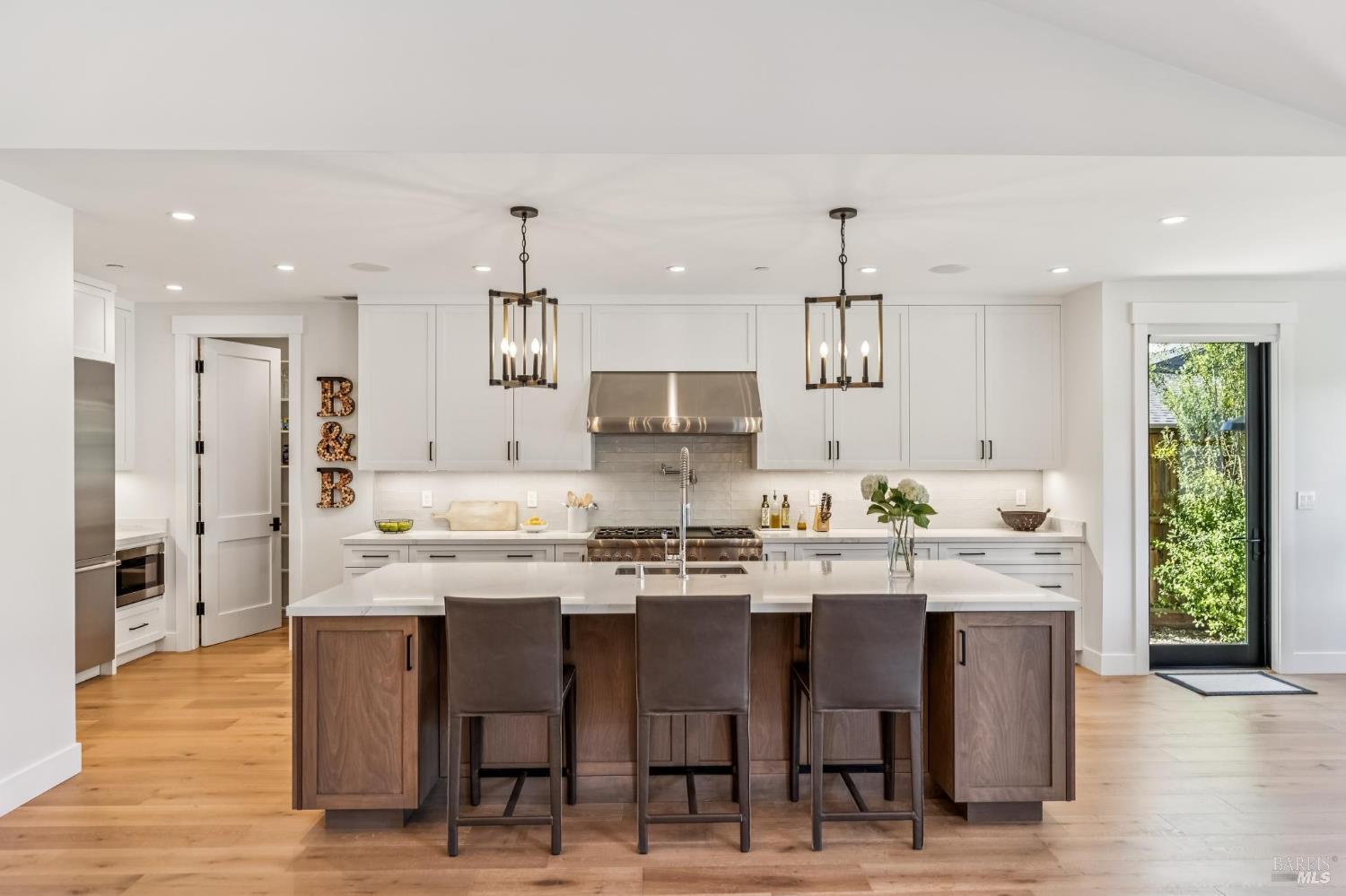 85 Harriet Way Tiburon, CA 94920 - Photo 11 of 44 a kitchen with stainless steel appliances kitchen island granite countertop a sink and cabinets