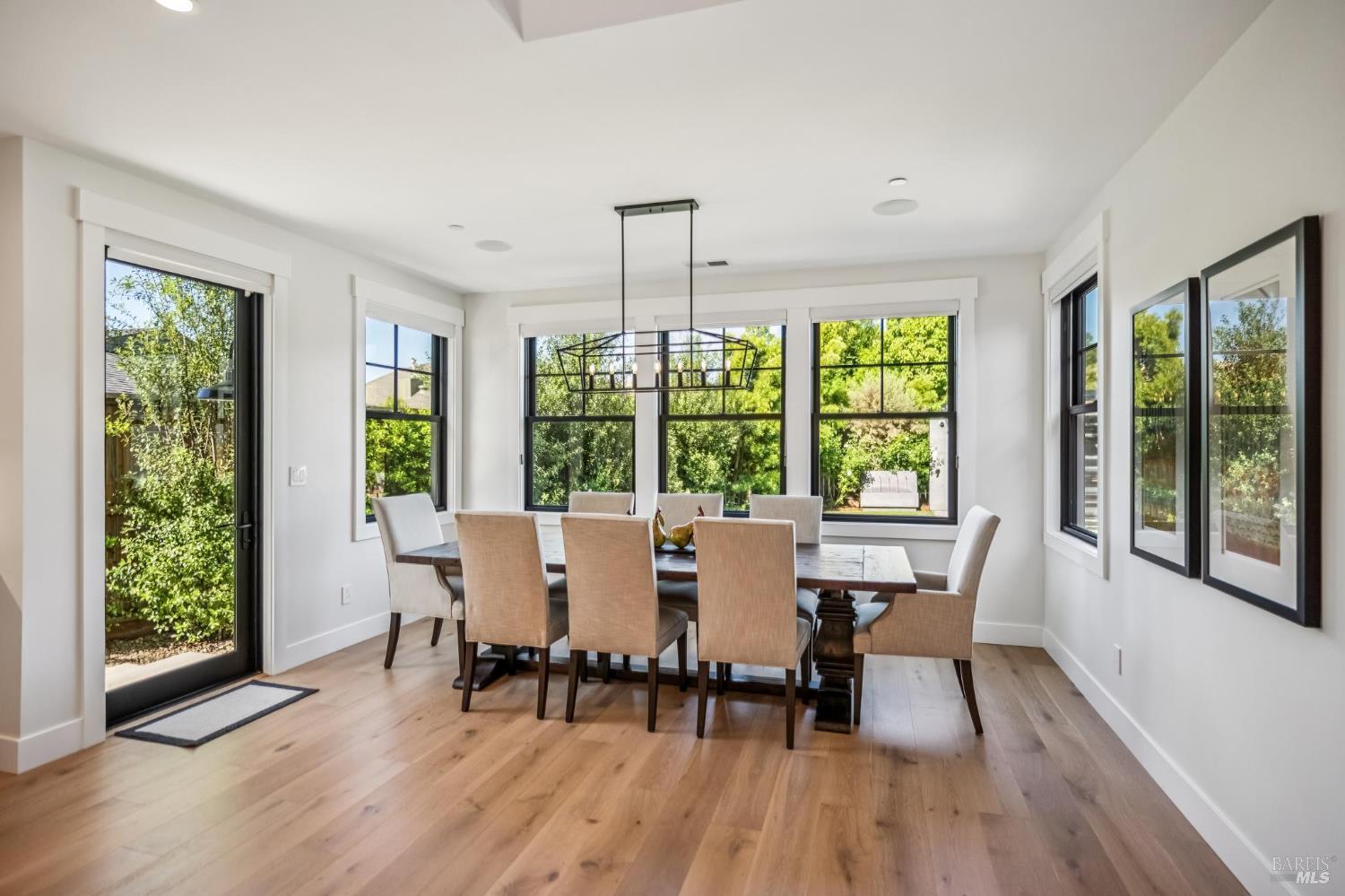 85 Harriet Way Tiburon, CA 94920 - Photo 15 of 44 a view of a dining room with furniture window and wooden floor