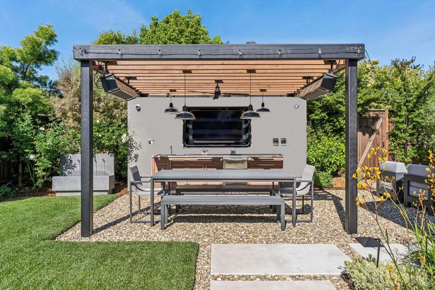 85 Harriet Way Tiburon, CA 94920 - Photo 30 of 44 a view of backyard with a table and chairs and potted plants