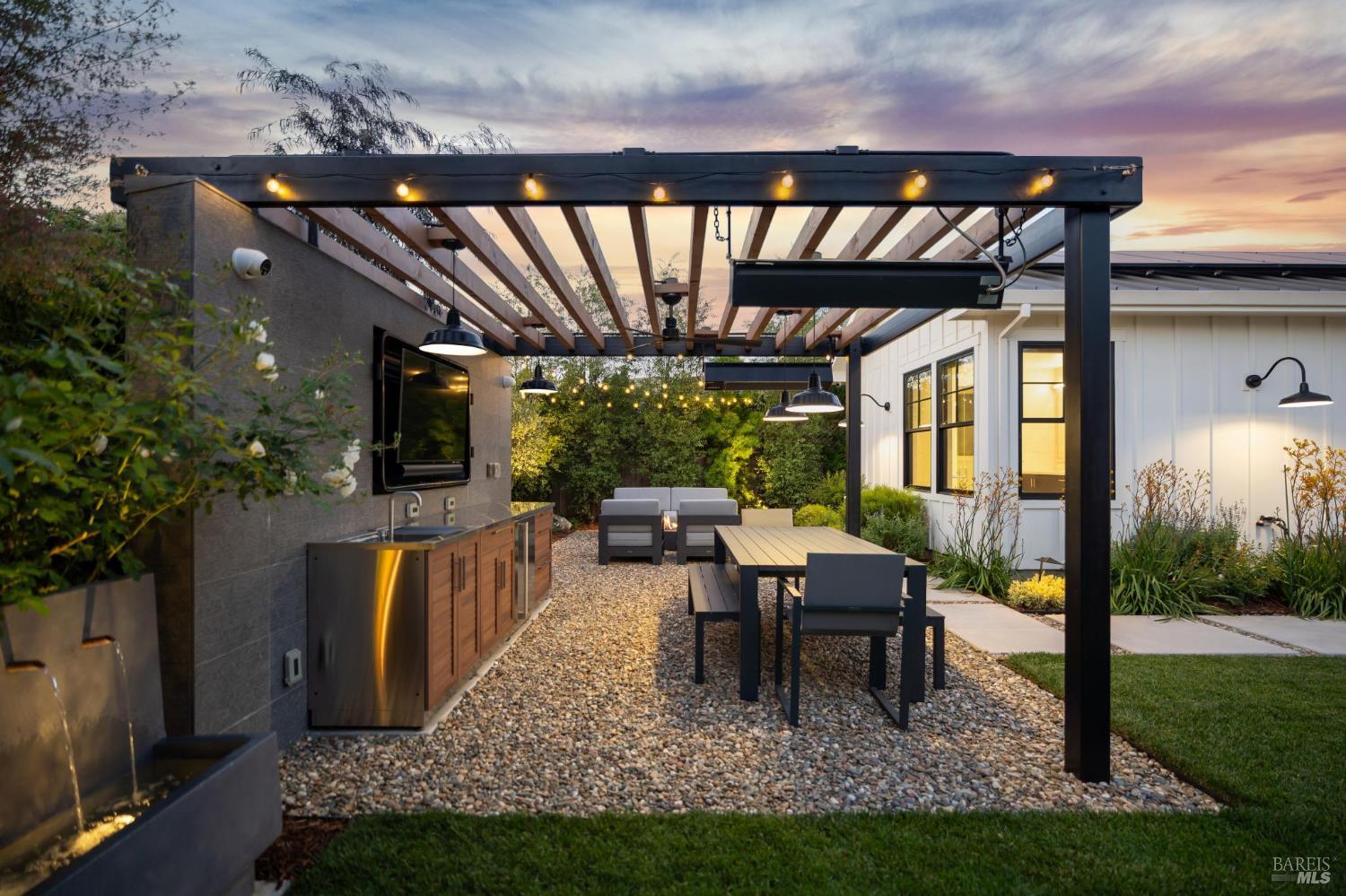 85 Harriet Way Tiburon, CA 94920 - Photo 40 of 44 a view of a patio with table and chairs potted plants with wooden floor and fence