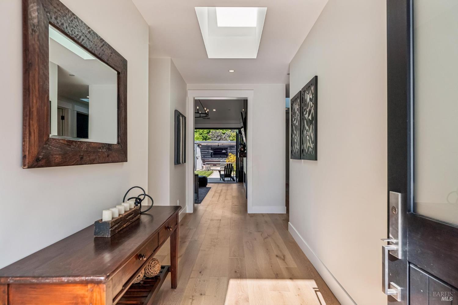 85 Harriet Way Tiburon, CA 94920 - Photo 5 of 44 a view of a hallway with wooden floor and a living room