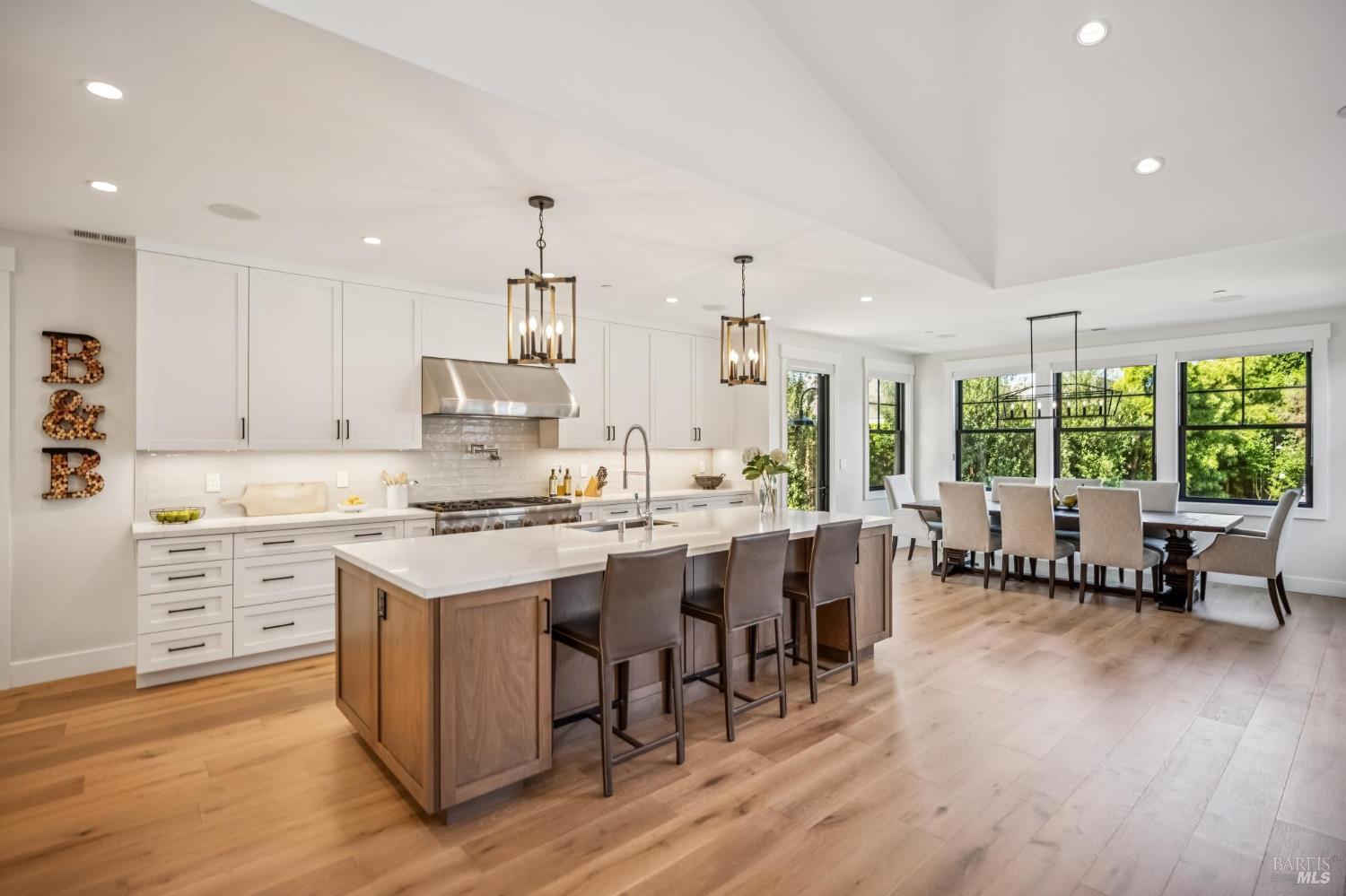 85 Harriet Way Tiburon, CA 94920 - Photo 10 of 44 a kitchen with stainless steel appliances granite countertop a stove and a wooden floors