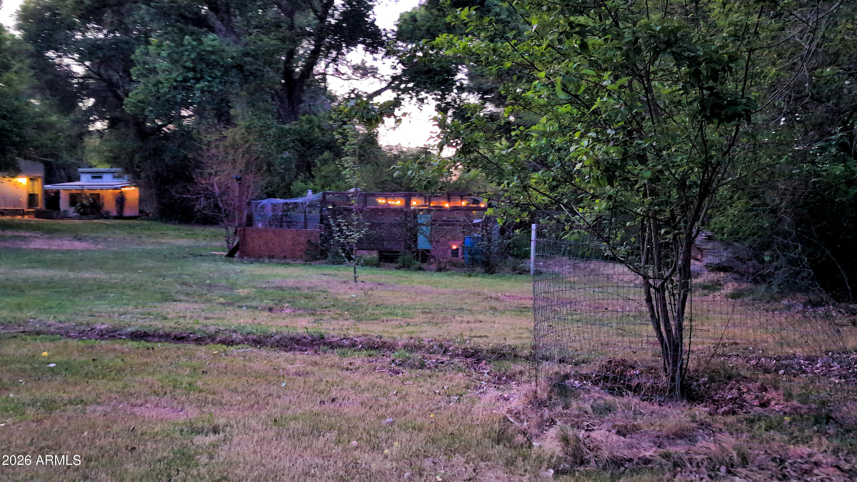 1165 North Willard Road Cottonwood, AZ 86326 - Photo 107 of 122 a view of a yard with a house in the background