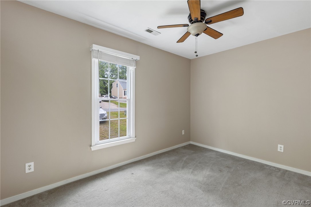 4906 Alberta Road Chesterfield, VA 23832 - Photo 13 of 21 en empty room with windows and ceiling fan