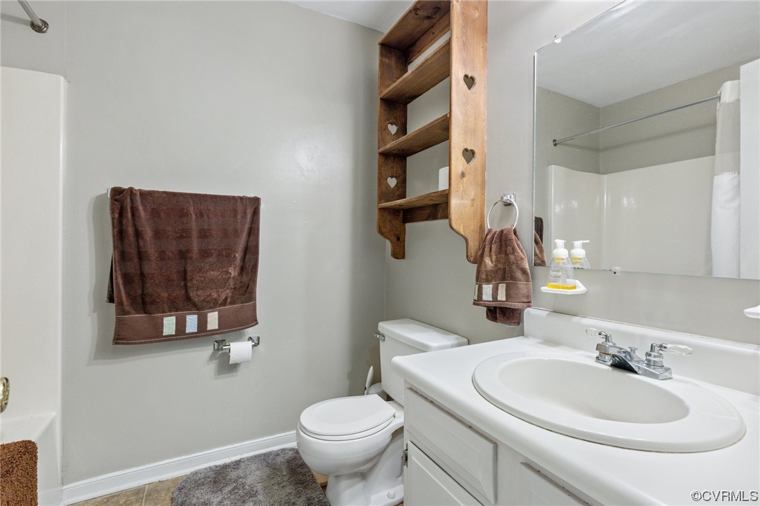 4906 Alberta Road Chesterfield, VA 23832 - Photo 15 of 21 a bathroom with a toilet sink and mirror