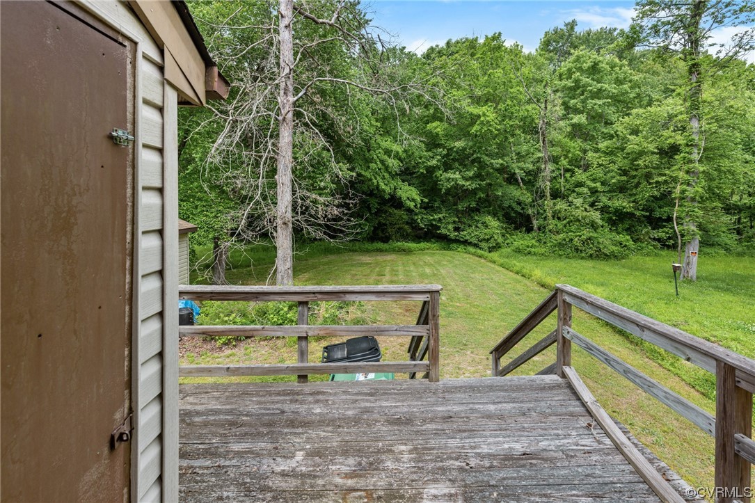4906 Alberta Road Chesterfield, VA 23832 - Photo 18 of 21 a view of a wooden deck with a yard